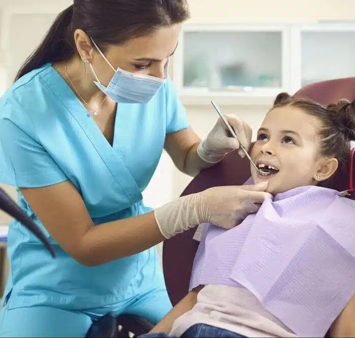 Smiling young patient with pediatric braces
