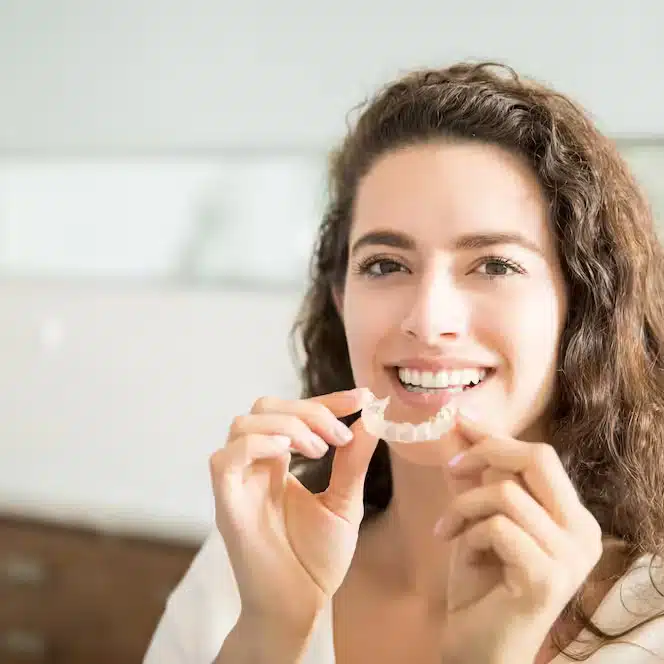 Professional woman with clear aligners