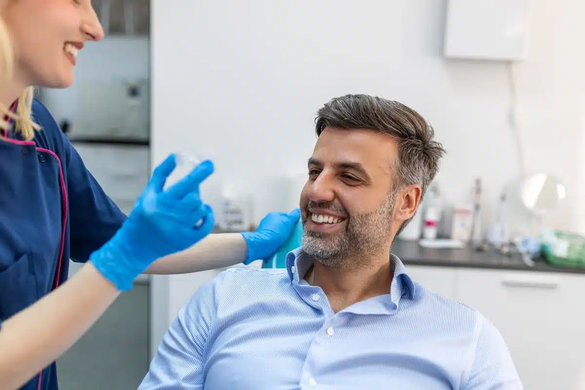 Professional man with clear aligners