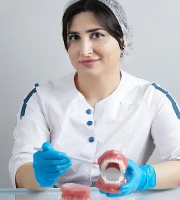 Orthodontist adjusting lingual braces on patient