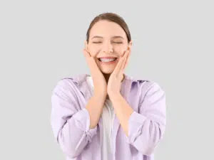Confident adult smiling with braces