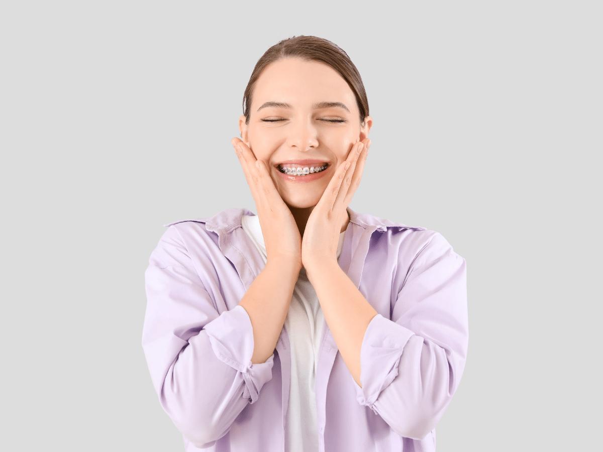 Confident adult smiling with braces